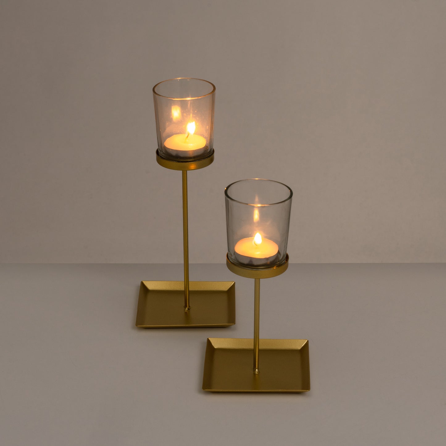 2 portavelas metal-cristal oro